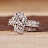 Lab grown coffin cut engagement ring with milgrain and four prong setting.