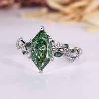 IGI certified green diamond ring with marquise side stones.