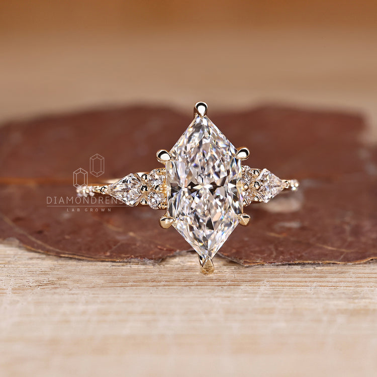 Marquise Diamond Engagement Ring with six claw prong and muse setting.
