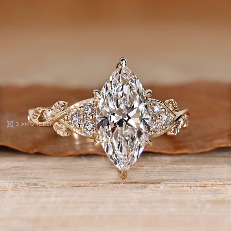 IGI certified marquise diamond ring with round diamond accents.