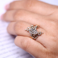 Nature inspired ring with six leaf prong setting.