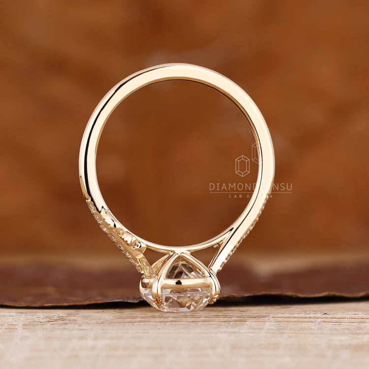 Nature inspired engagement ring with round old european cut diamond detail.
