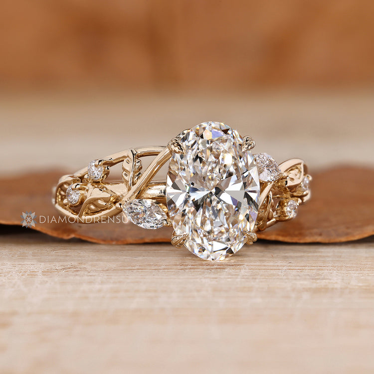 Four leaf style prong setting secures the oval center stone.
