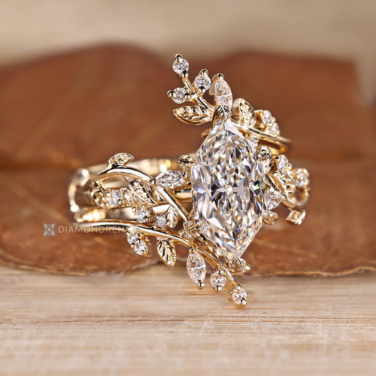 Six leaf prong setting secures the Dutch marquise center stone.