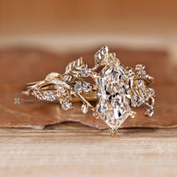 Marquise and round diamond wedding ring with leaf prongs