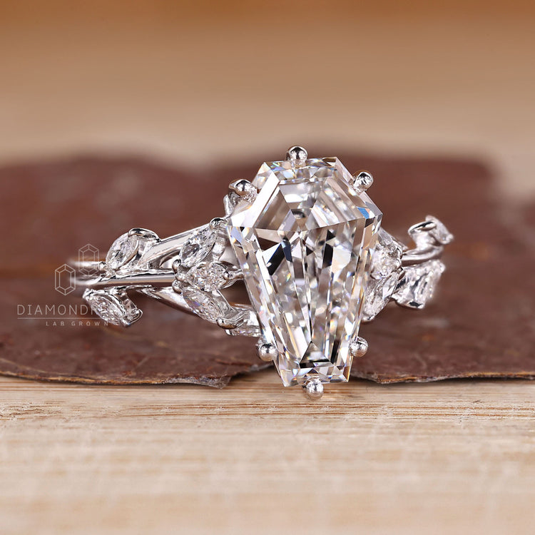 IGI certified coffin cut diamond ring with marquise accents.