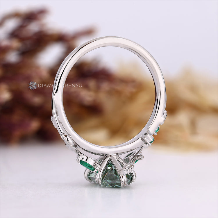 Handmade Dutch marquise diamond ring with a green center stone.