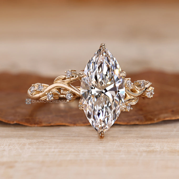 Nature inspired style shapes this marquise engagement ring.