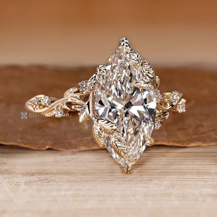 Handmade marquise diamond ring with leaf style prongs.