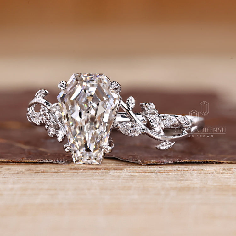 Diamondrensu coffin ring with lab grown diamond center stone.