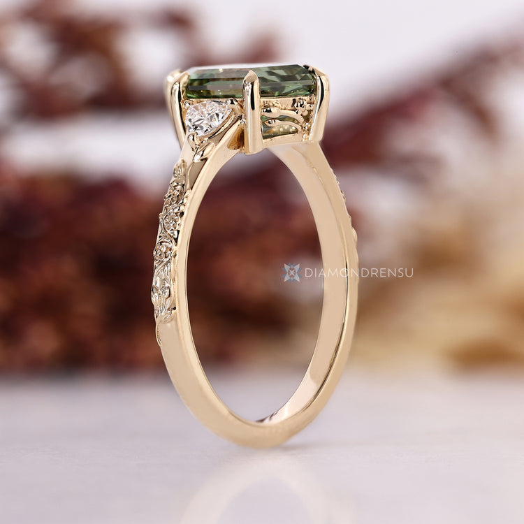 Nature inspired three stone style diamond ring with a hexagon shape.