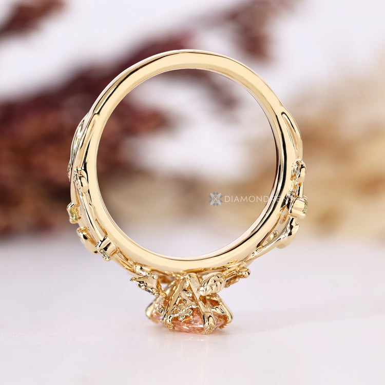 Pink center marquise diamond ring with twisted shank.