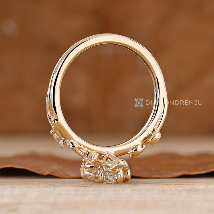 Pear cut diamond ring with five claw prong setting.