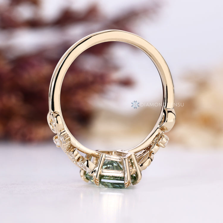 Green Dutch marquise diamond ring in a nature inspired style.