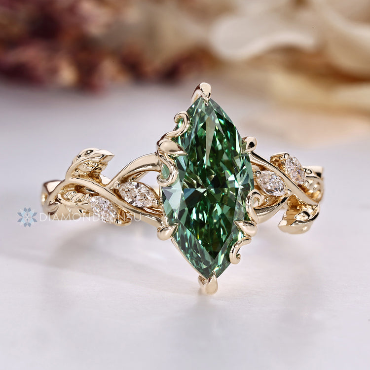 Blooming Flower Bud Setting surrounds the center stone.