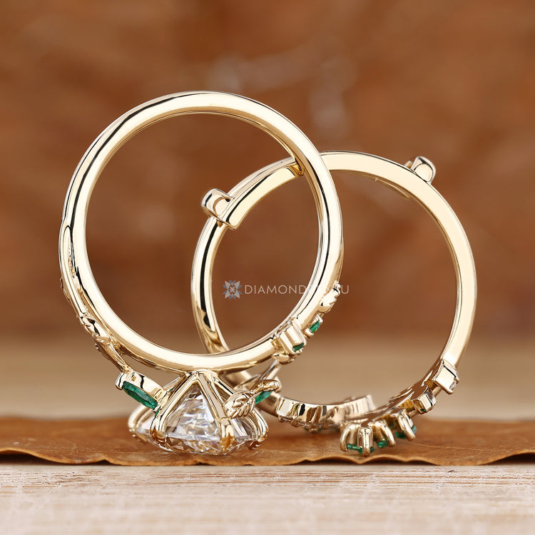 Dutch marquise bridal set with a six leaf style prong setting and botanical vine band.