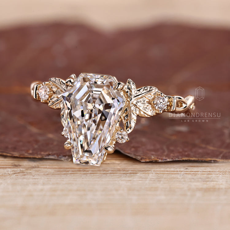 Diamondrensu coffin ring with lab grown diamond center stone.