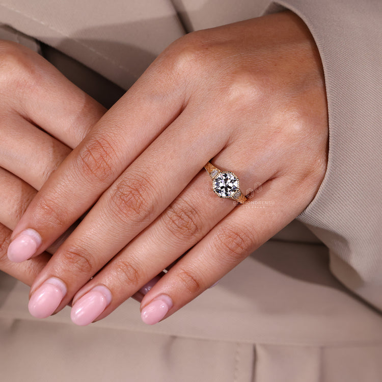 Octagon OEC Diamond Ring With Eight Claw Prong And Milgrain Edge.
