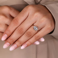 Cushion old mine cut diamond ring with double claw prongs.
