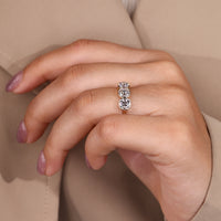 Lab grown cushion old european cut diamond three stone ring.
