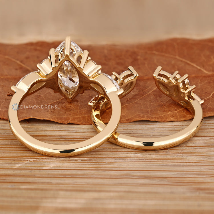 Lab grown diamond marquise wedding ring with side stones.