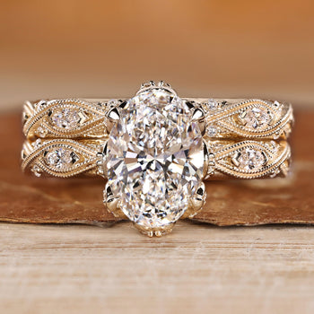 Oval bridal set with marquise and round side stones in vintage style.