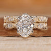 Oval bridal set with marquise and round side stones in vintage style.