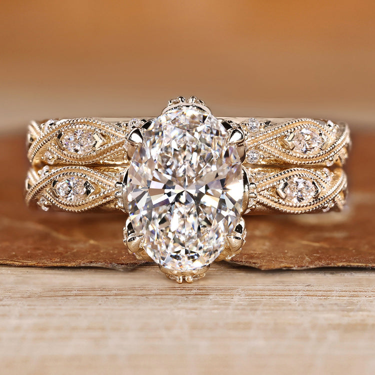 Oval bridal set with marquise and round side stones in vintage style.