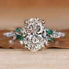 Oval engagement ring with round and marquise side stones.