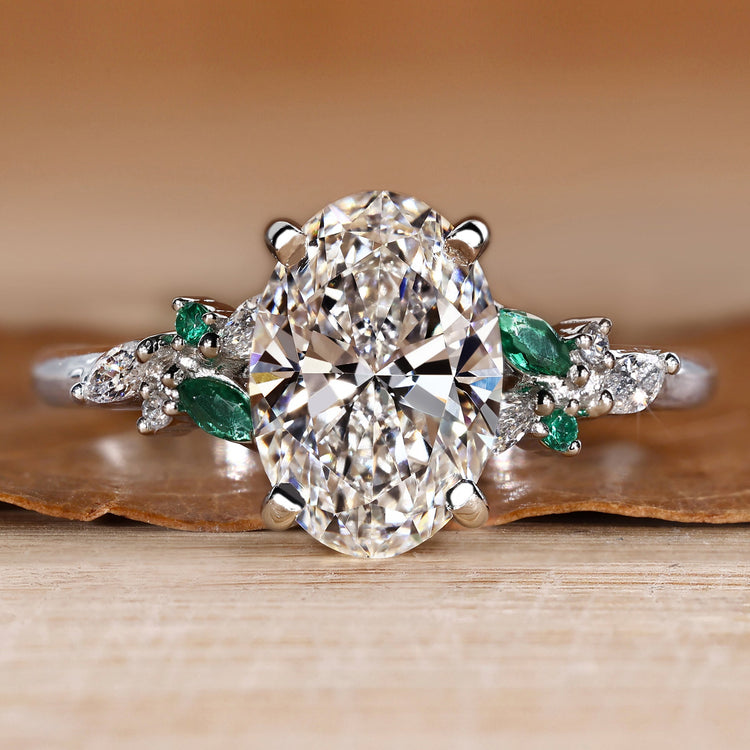 Oval engagement ring with round and marquise side stones.
