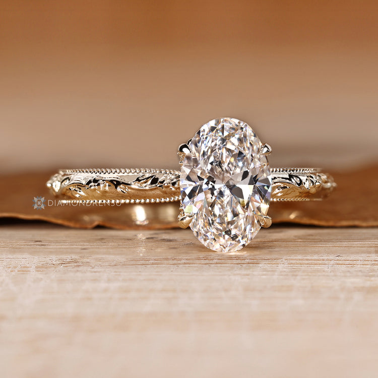 Art Deco oval ring with milgrain details.