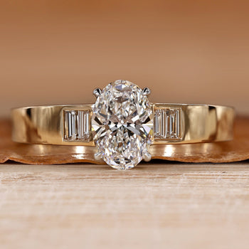Oval cut diamond ring with baguette side stones.