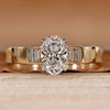 Oval cut diamond ring with baguette side stones.