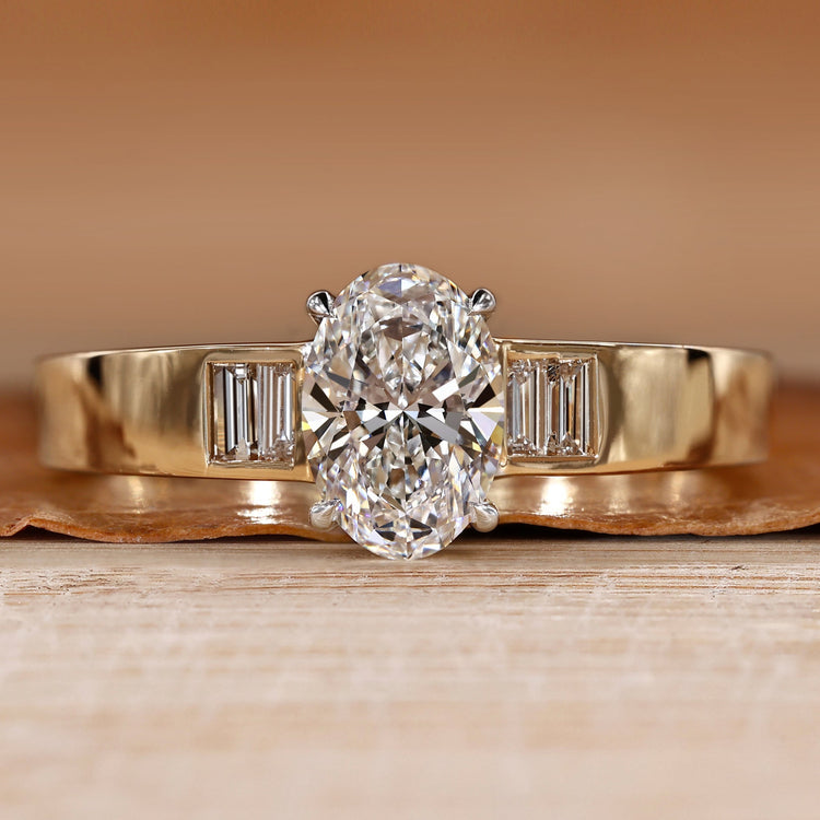 Oval cut diamond ring with baguette side stones.