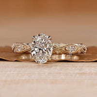 Oval diamond ring with round and marquise accents.