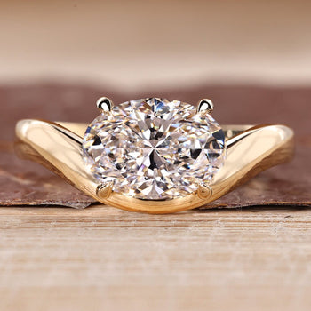 Oval cut diamond ring with east to west setting and solitaire style.