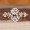 Nature inspired ring featuring oval diamond and vintage engagement design.
