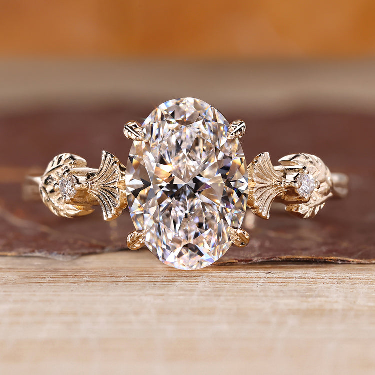Nature inspired ring featuring oval diamond and vintage engagement design.
