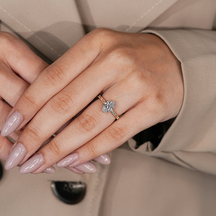 Nature inspired oval engagement ring with a six claw prong setting.