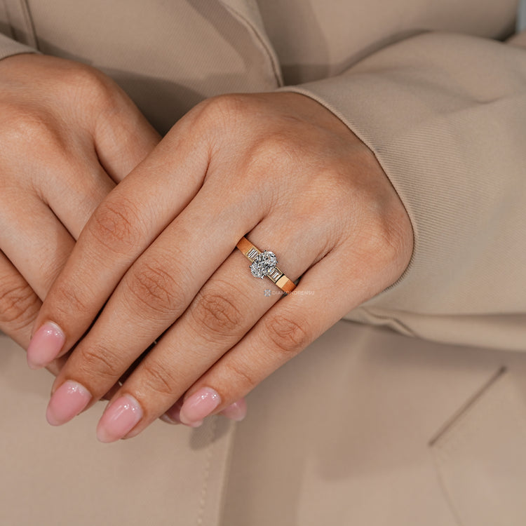 Five stone oval diamond ring with baguette side stones.
