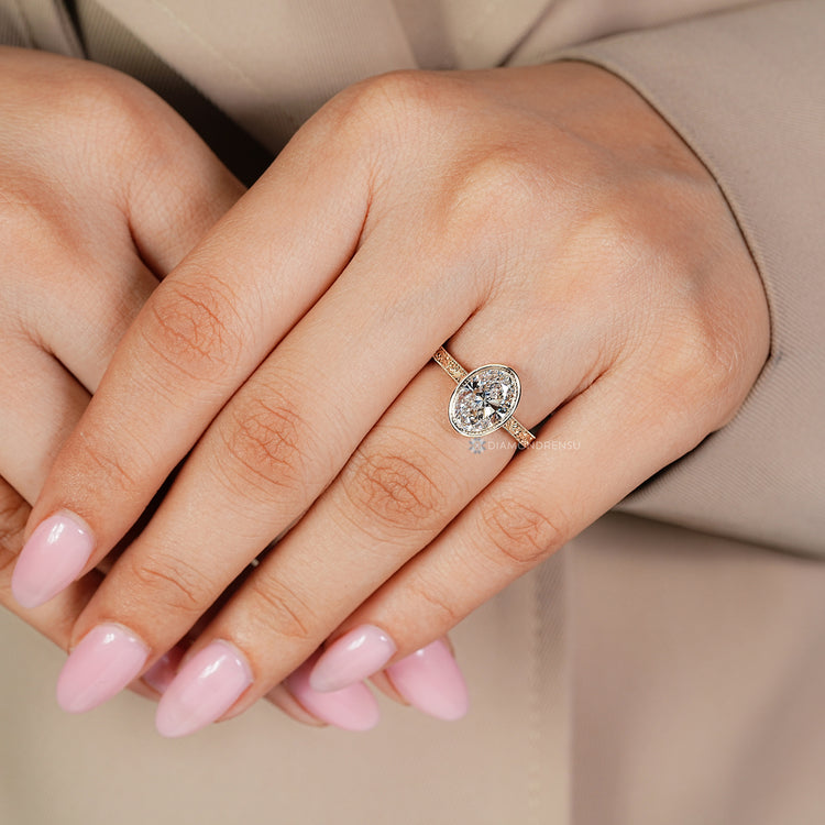 Handmade Art Deco oval diamond ring with bezel setting.