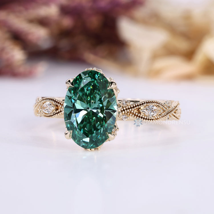 Diamondrensu oval ring with lab grown green center stone.