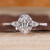 Oval cut lab grown diamond ring with pear side stones.