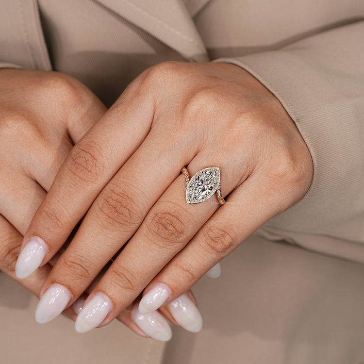 IGI certified marquise diamond ring with six claw prongs.
