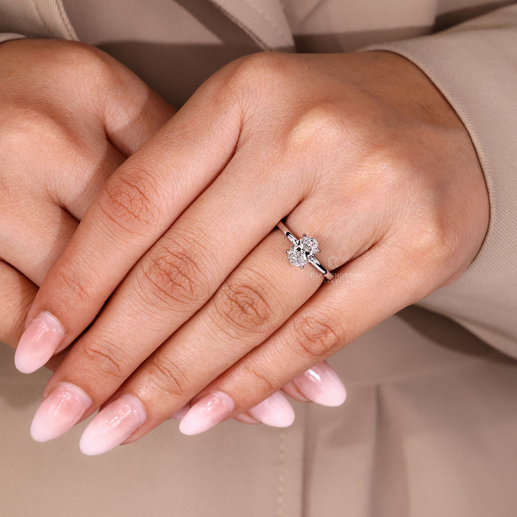IGI certified oval diamond ring with solitaire setting and round cut halo.