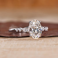 Lab grown diamond oval cut ring with cathedral and claw prong setting.