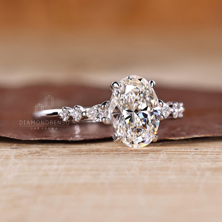 Lab grown diamond oval cut ring with cathedral and claw prong setting.