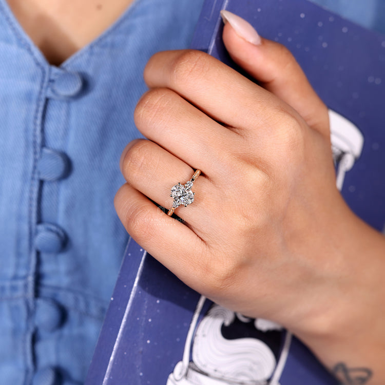 Vintage style three diamond ring with tapered shank and basket setting.