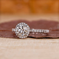 Pave setting surrounds the round cut diamond beautifully.
