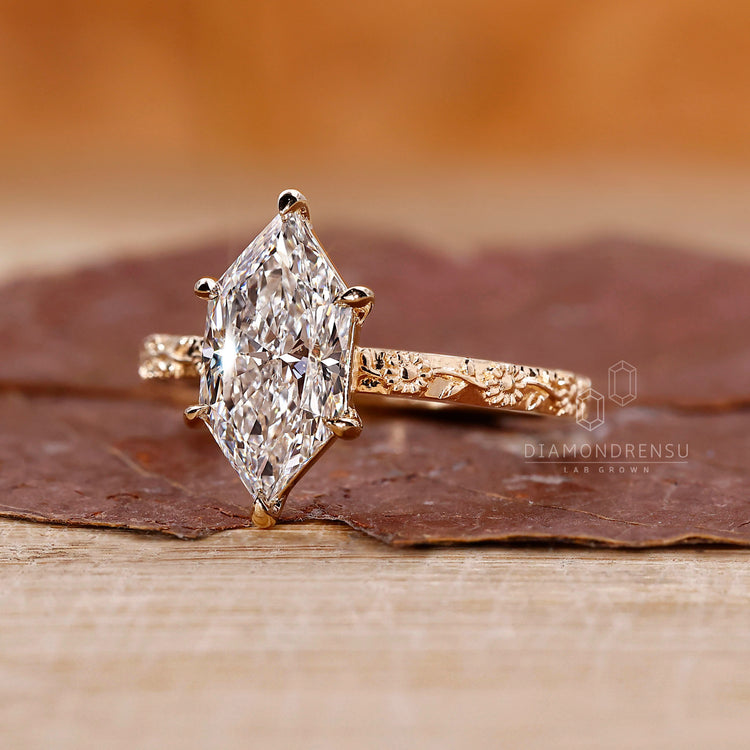 Buy lab-grown ring with a marquise diamond, offering a sustainable and affordable alternative.
